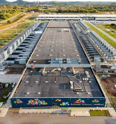 Aerial view of a large-scale industrial facility in Saint-Ghislain, Mons, representing scalable workforce housing solutions.